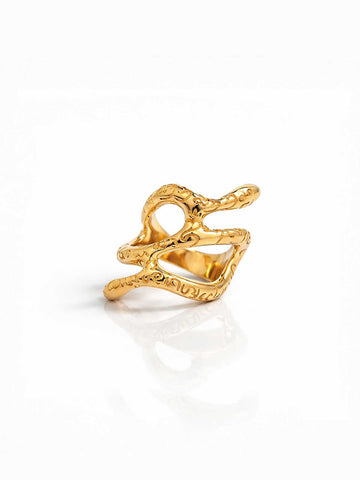 Gold ring with intricate design on a white background