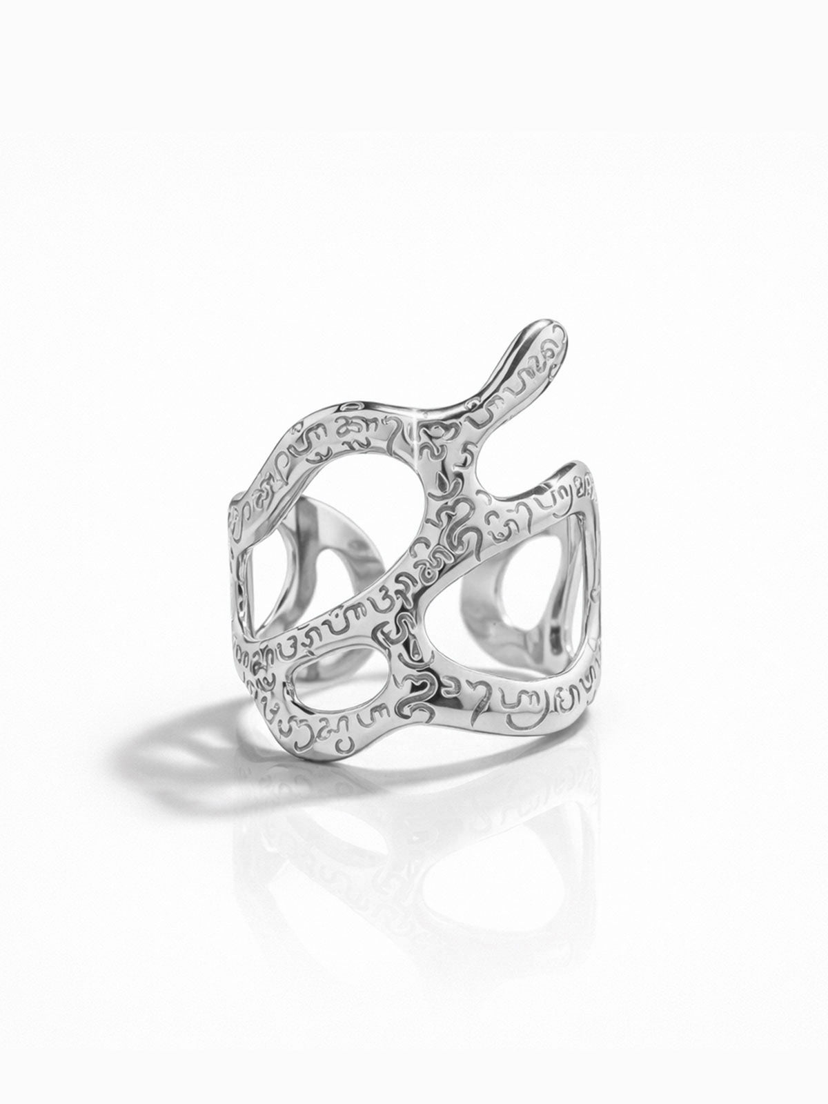 Silver bracelet with intricate design on a white background
