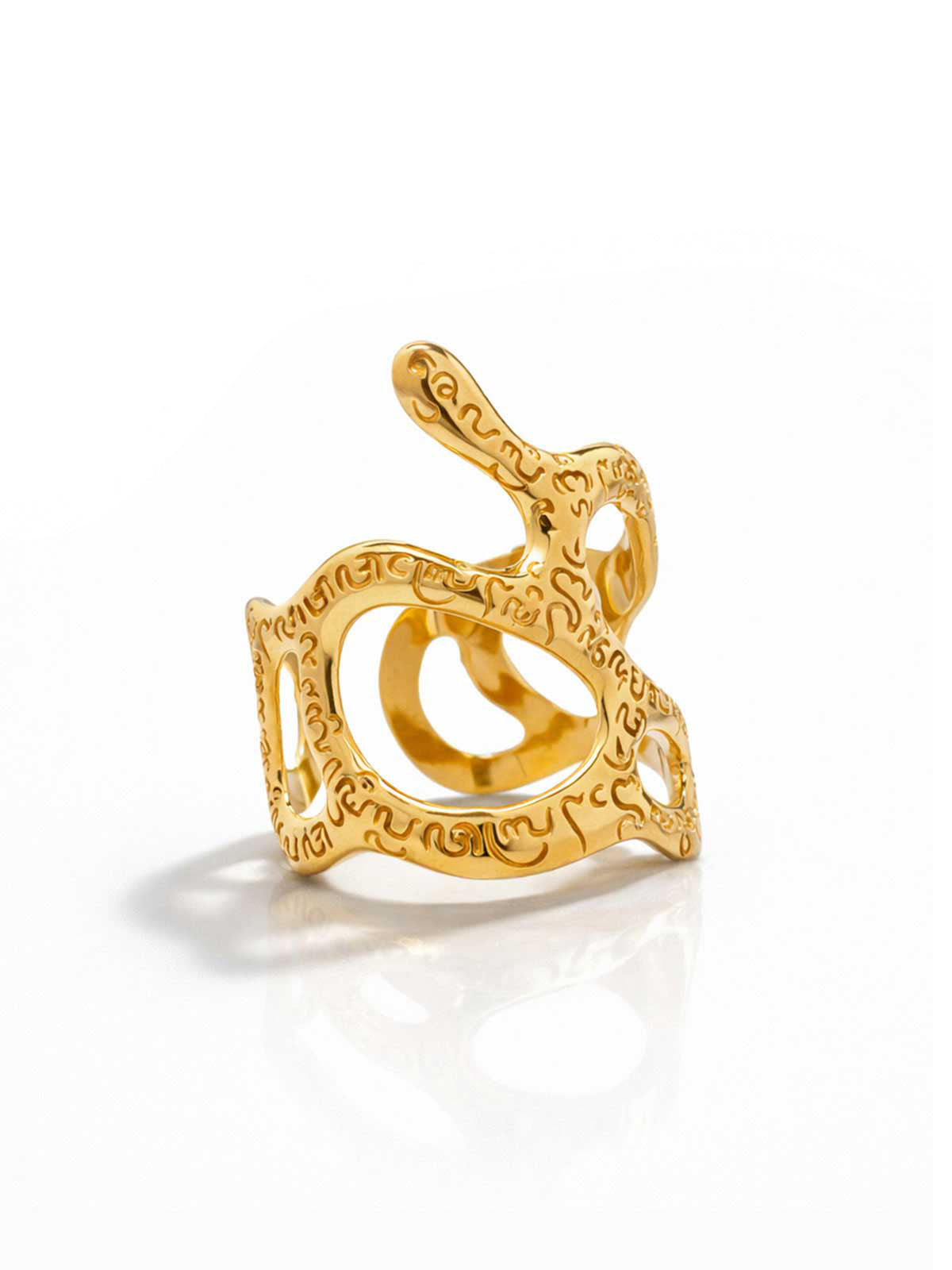 Gold bracelet with intricate design on a white background