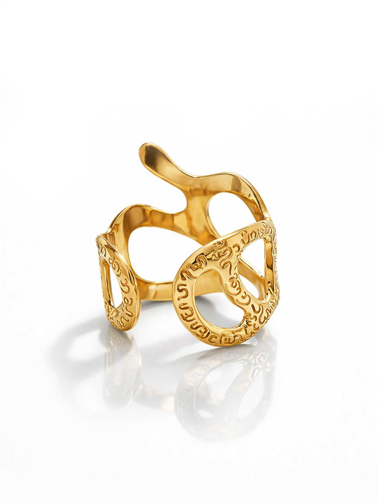 Gold bracelet with intricate design on a white background