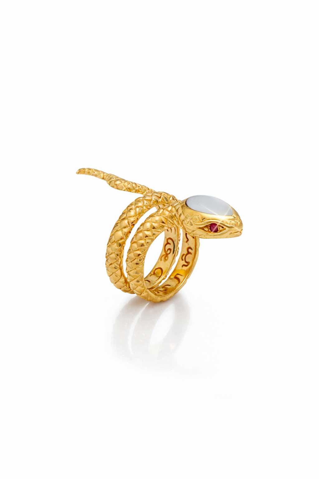 Gold snake-shaped ring with a white stone on a white background