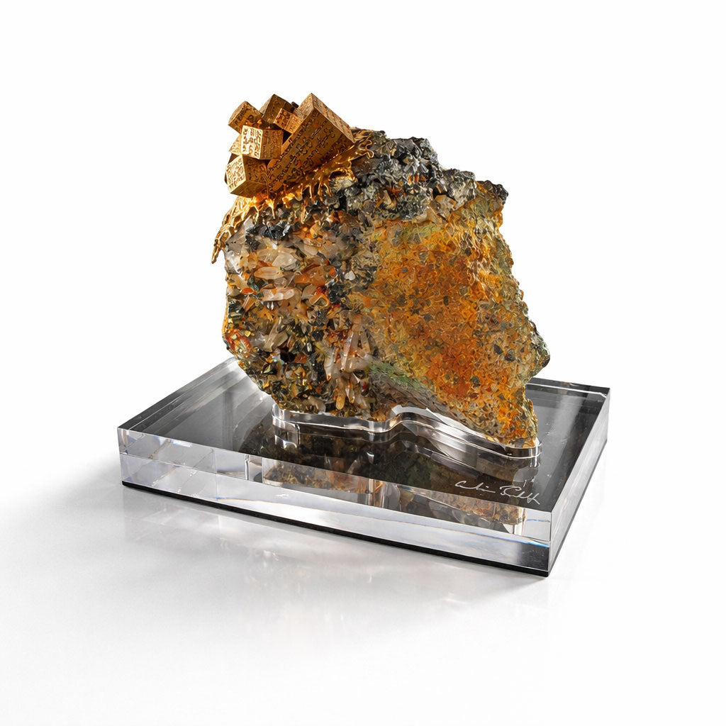 Mineral specimen pyrite, rock crystal and calcite on a clear acrylic stand against a white background