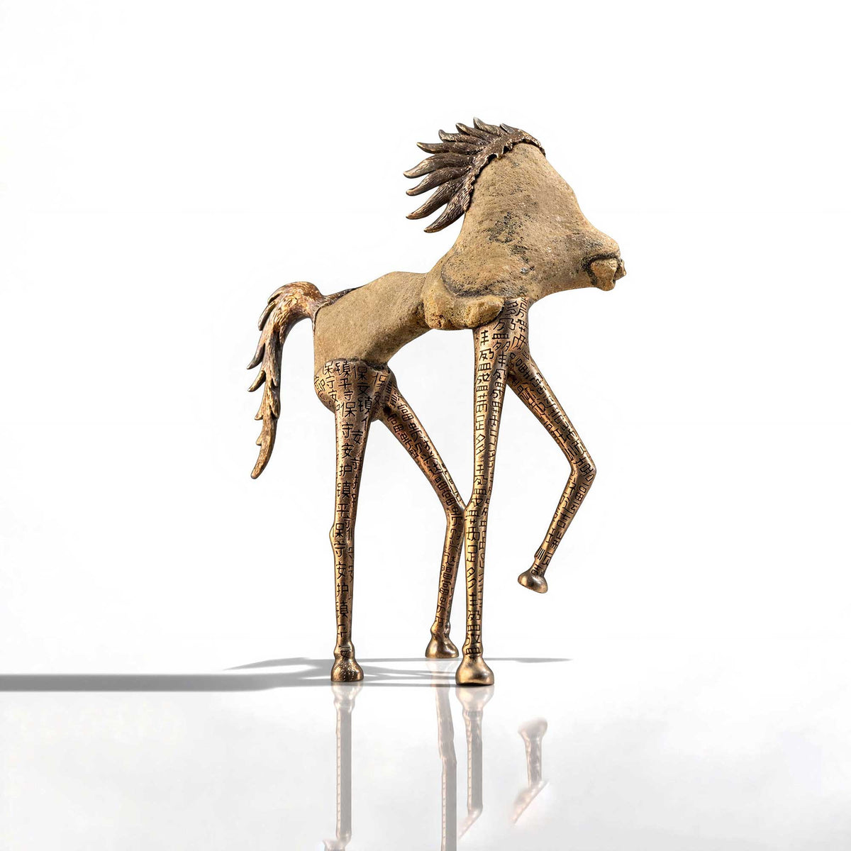 Bronze horse sculpture on a white background
